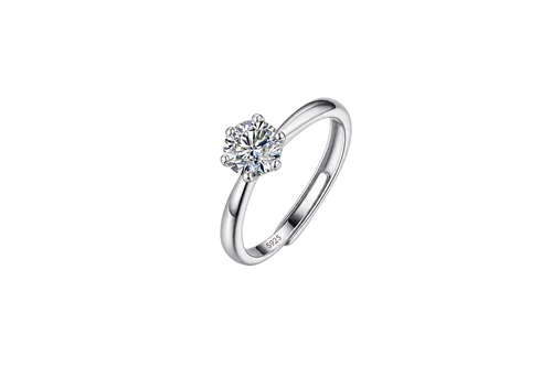 A silver solitaire engagement ring with a round brilliant-cut diamond set in a four-prong setting, shown on a plain white background. The inside of the band features a '925' sterling silver hallmark.