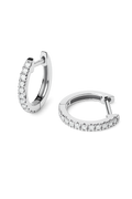 A pair of silver huggie hoop earrings embellished with clear pavé-set round stones, shown on a clean white background.