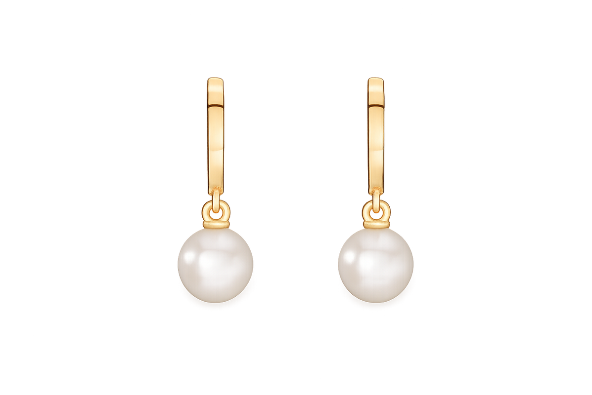 A pair of gold huggie hoop earrings with a single round white pearl drop on each earring, shown against a plain white background.
