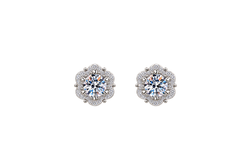 A pair of silver-toned stud earrings with round-cut iridescent center stones surrounded by small clear stones in a floral halo setting, shown on a plain white background.