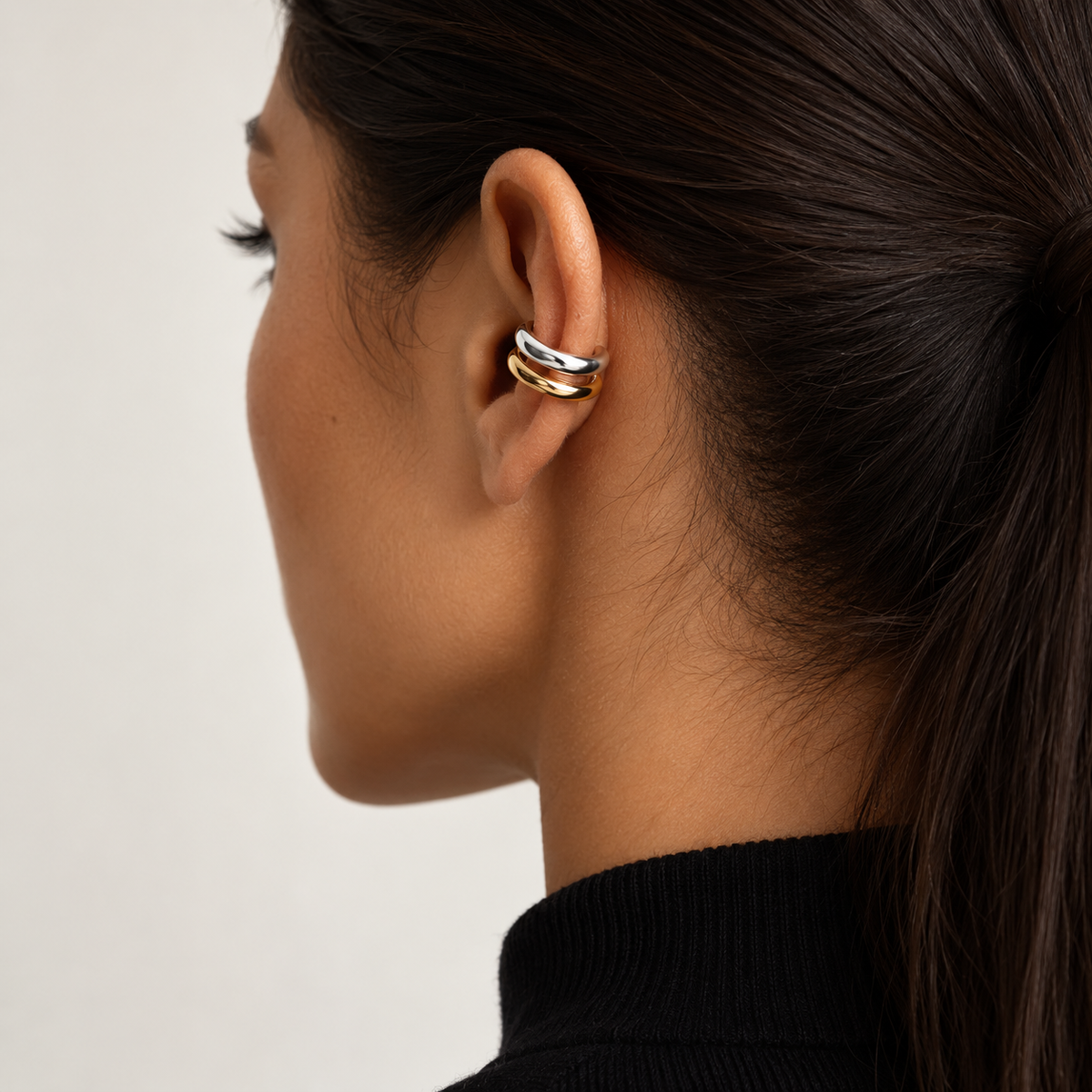 JURÉA Harmonie Ear Cuff worn on ear – two-tone 925 sterling silver ear cuff with gold and rhodium finish