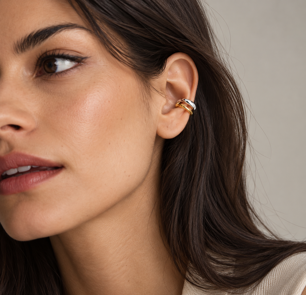 JURÉA Harmonie Ear Cuff worn on ear – two-tone 925 sterling silver ear cuff with gold and rhodium finish