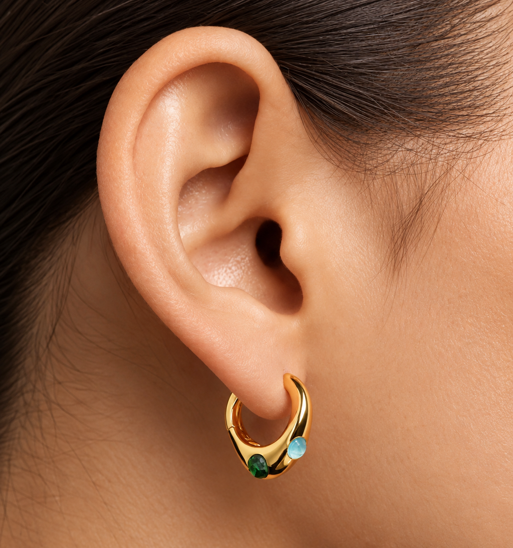 JURÉA Riviera Hoops worn on ear – 18K gold plated hoops with green and aqua stones