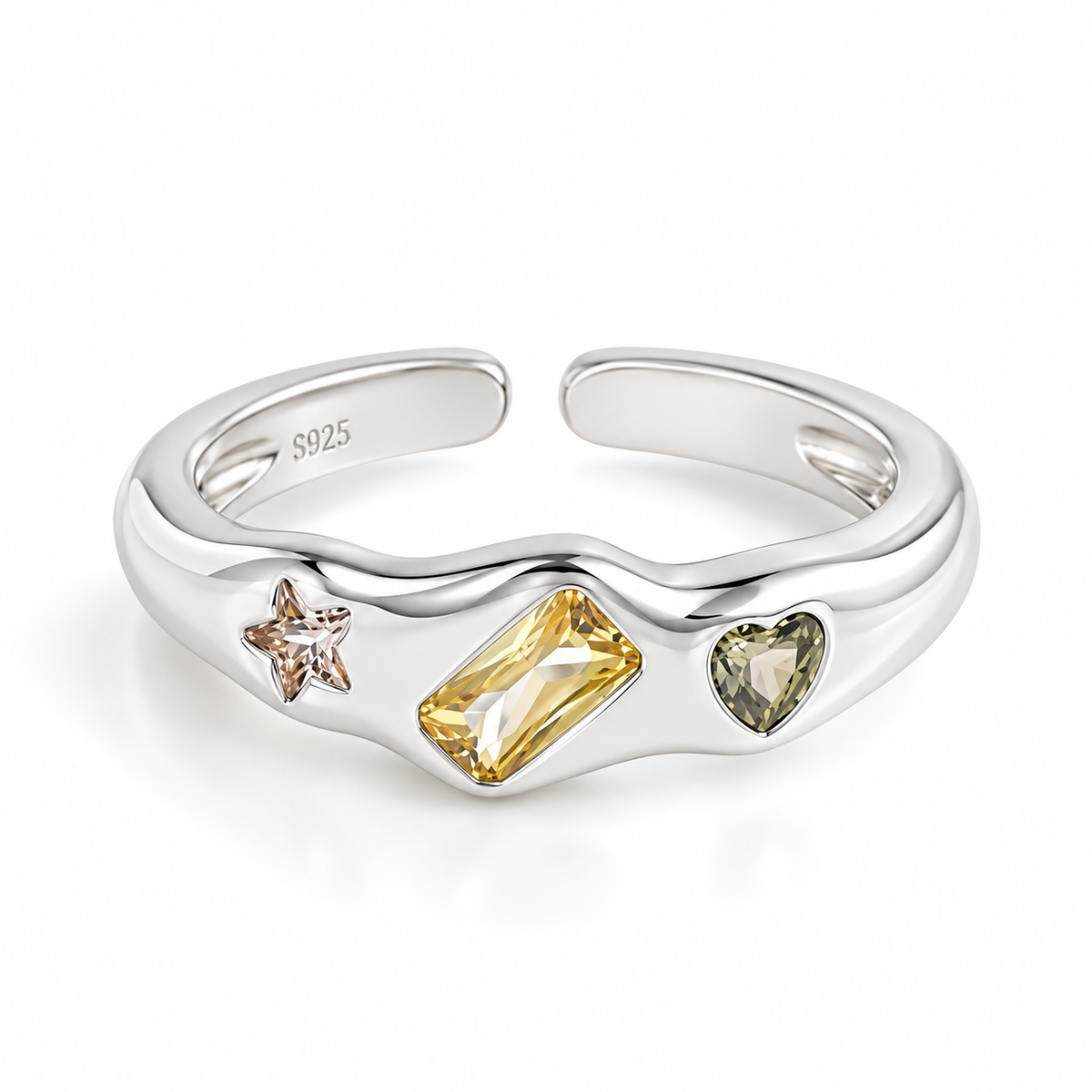 A sterling silver adjustable ring with three inlaid gemstones: a rectangular yellow crystal, a heart-shaped green crystal, and a star-shaped rose gold crystal, shown on a white background.